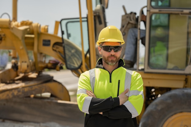 Portrait worker in construction helmet engineer builder foreman or repairman worker at building site