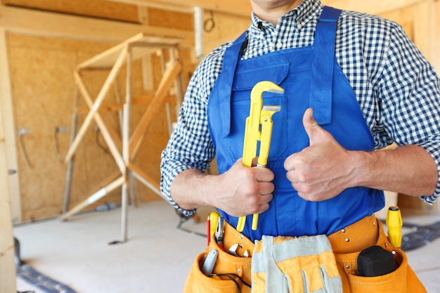 Portrait of workman with adjustable wrench