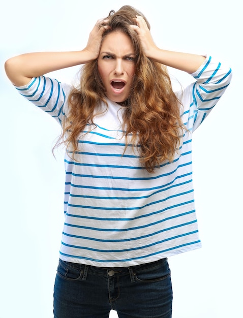 Portrait of worried young woman reacting to bad news