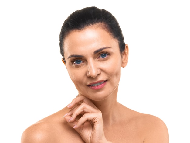 Portrait of a years old woman looking at camera and smiling isolated on white background