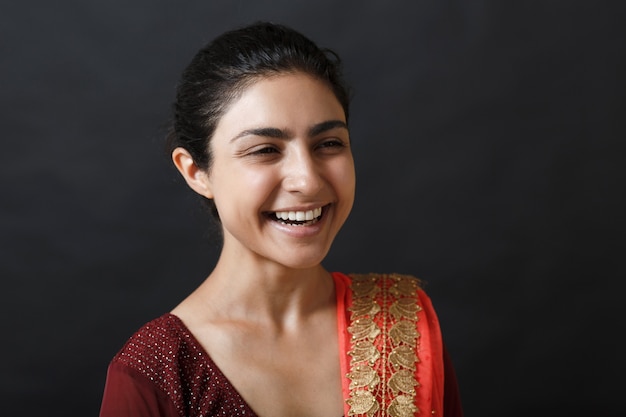 Portrait of young adult smiling indian east asian woman in sari