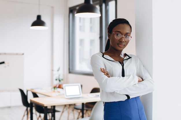 Portrait of a young African American business woman in modern loft office