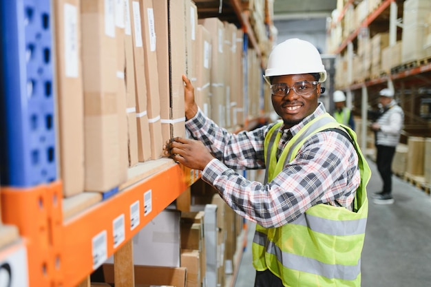 portrait of a young african american warehouse worker working in a cash and carry wholesale store