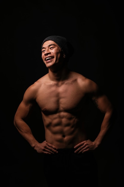 Portrait of young asian boy with fitness body. Positive attitude.