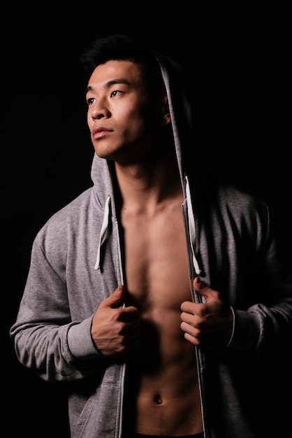 Portrait of young asian boy with sportswear. Challenging attitude.