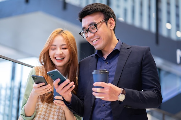 Portrait of young Asian business people at office