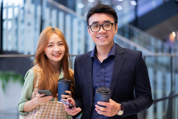 Portrait of young Asian business people at office