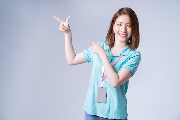 Portrait of young Asian businesswoman on white background