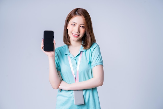 Portrait of young Asian businesswoman on white background