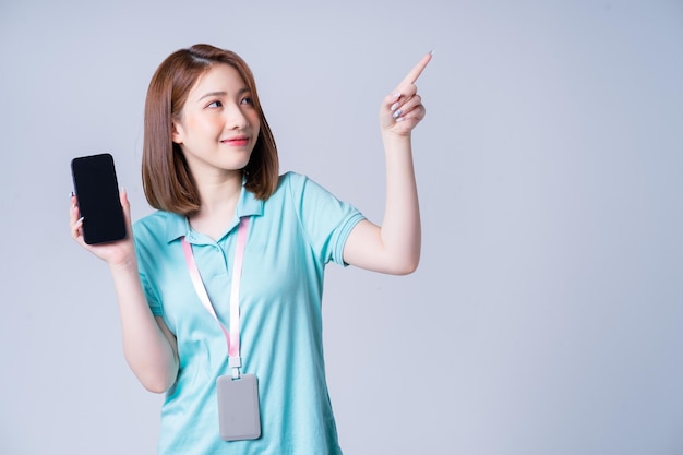 Portrait of young Asian businesswoman on white background