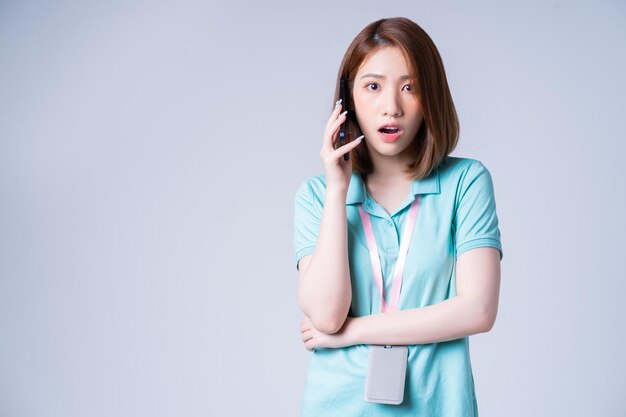 Portrait of young Asian businesswoman on white background