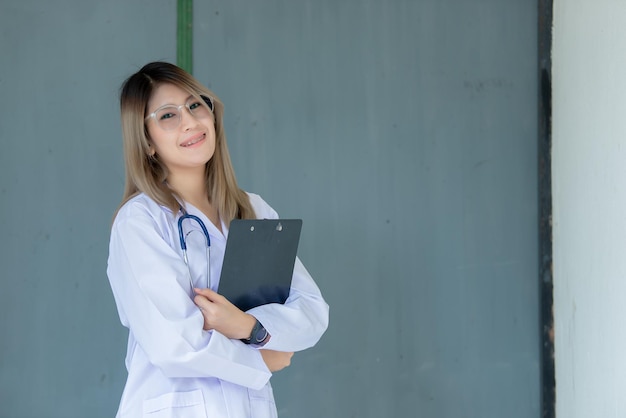 Portrait of young asian doctor wear glasses in a hospitalThailand people