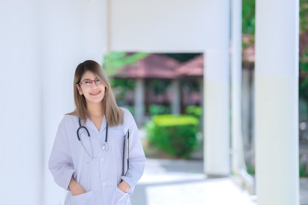 Portrait of young asian doctor wear glasses in a hospitalThailand people