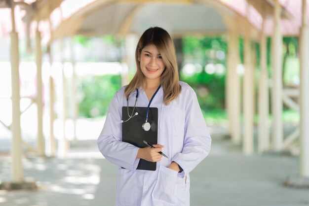 Portrait of young asian doctor wear glasses in a hospitalThailand people