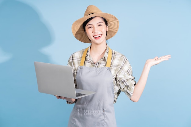 Portrait of young Asian female farmer