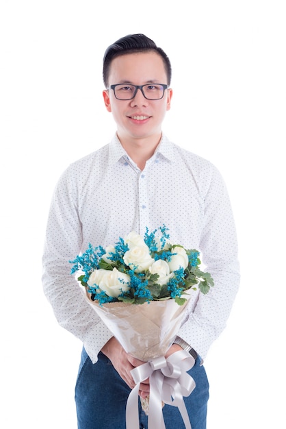 Portrait of young asian man holding flowers