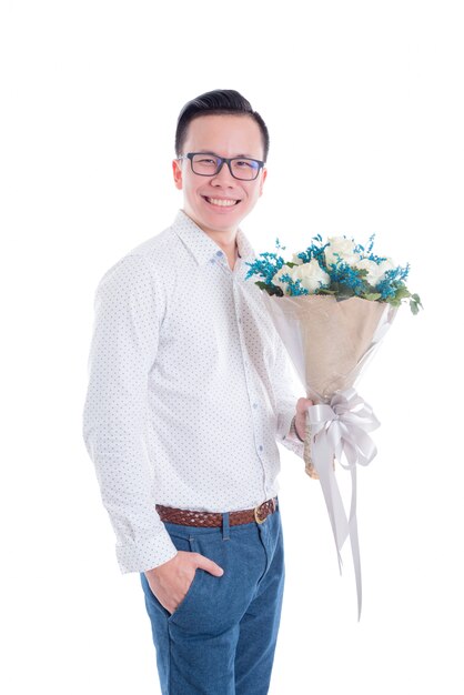 Portrait of young asian man holding flowers 