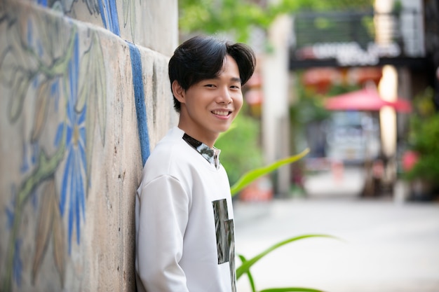 portrait young asian man posed outdoor