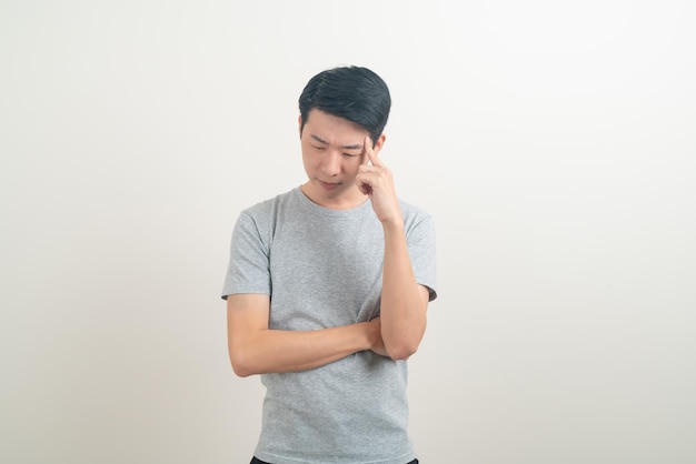 portrait young Asian man thinking on white background