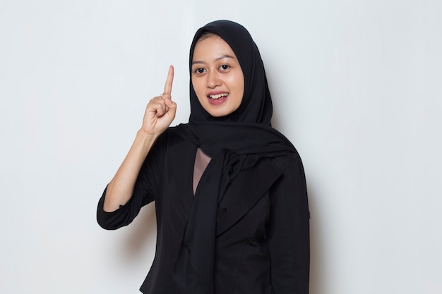 portrait of a young asian muslim woman thinking idea