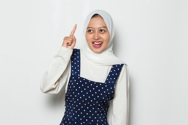 Portrait of a young asian muslim woman thinks idea