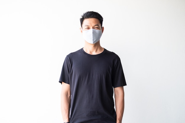 Portrait of young Asian wearing homemade fabric mask