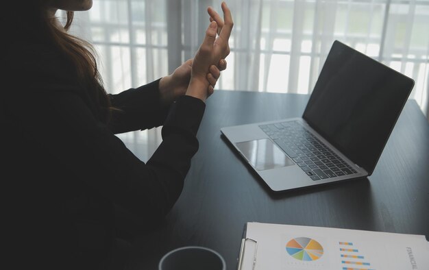 Portrait of Young Asian woman hand freelancer is working her job on computer tablet in modern office Doing accounting analysis report real estate investment data Financial and tax systems concept