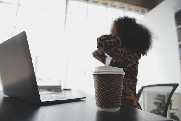 Photo portrait of young asian woman hand freelancer is working her job on computer tablet in modern office doing accounting analysis report real estate investment data financial and tax systems concept