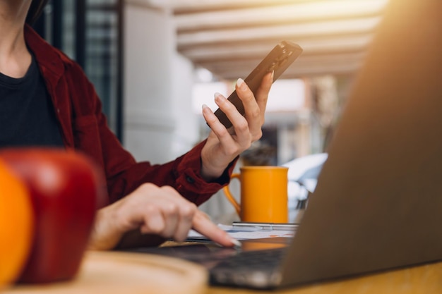 Portrait of Young Asian woman hand freelancer is working her job on computer tablet in modern office Doing accounting analysis report real estate investment data Financial and tax systems concept