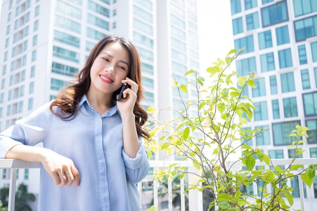 Portrait of young Asian woman at home