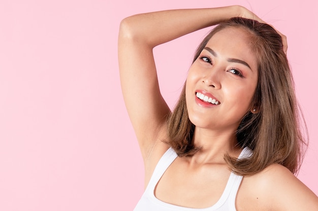 Portrait of a young Asian woman smiling happily