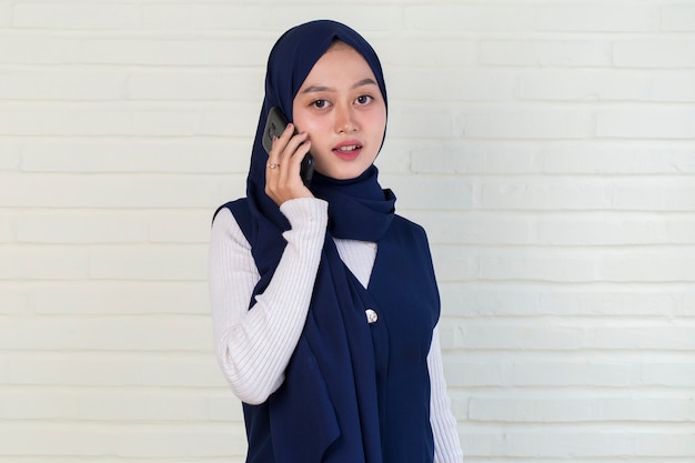 Portrait of a young asian woman using mobile phone