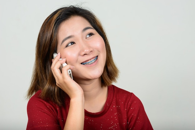 Portrait of young Asian woman with short hair