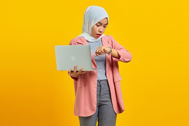 Portrait of young asian woman worried work deadline stress on yellow background