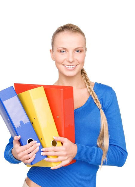 Portrait of a young attractive businesswoman with folders