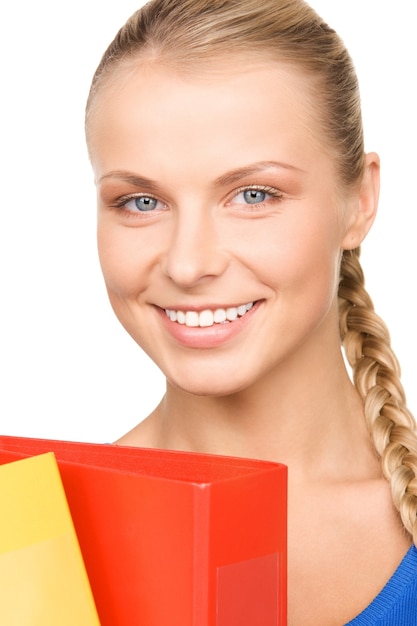 Portrait of a young attractive businesswoman with folders