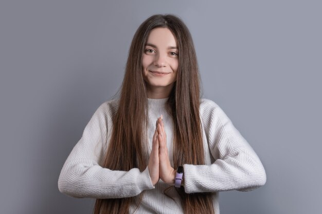 Portrait of a young attractive girl with dark long hair