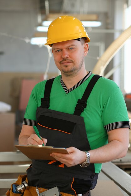 Portrait of young attractive man in work