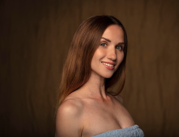 portrait of a young attractive woman on a dark background