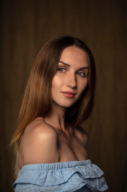 portrait of a young attractive woman on a dark background