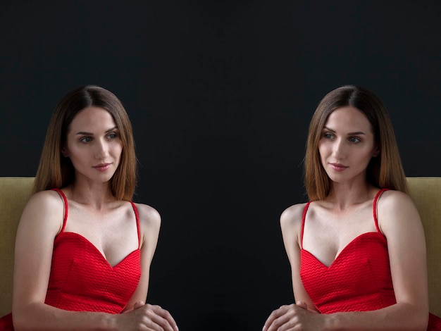 portrait of a young attractive woman on a dark background