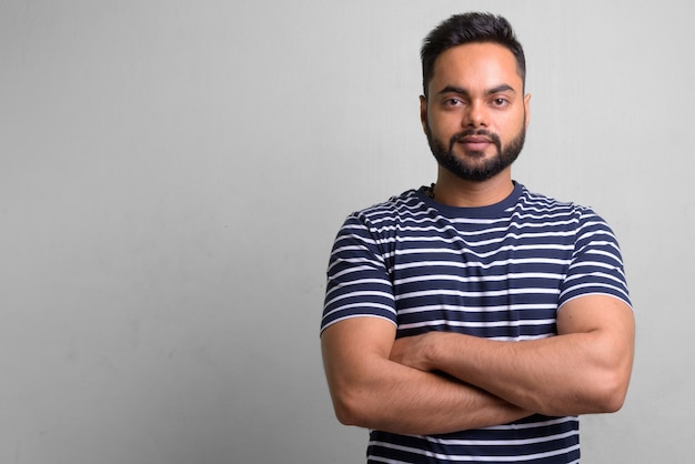 portrait of young bearded Indian man on white