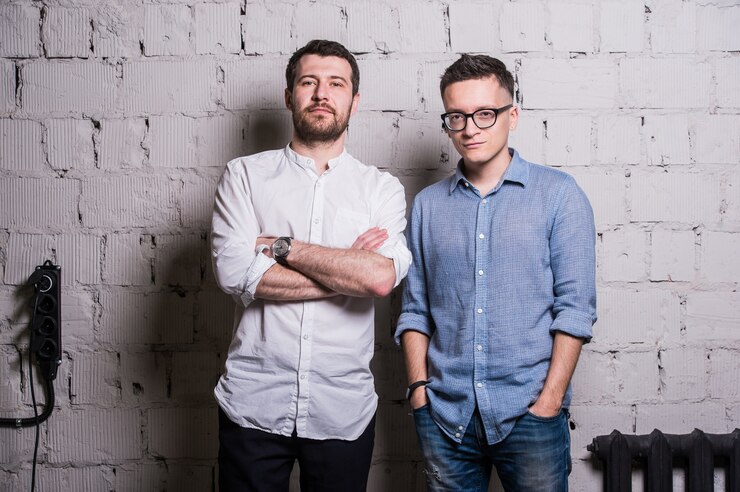 Portrait of young bearded man and guy with glasses