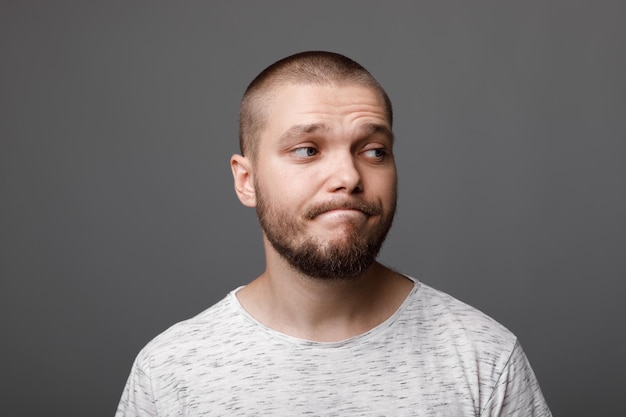 The portrait of the young bearded man