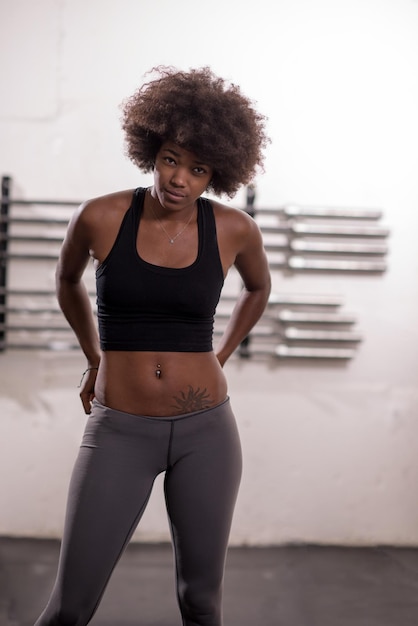 portrait of a young beautiful African American women in sports clothes after a workout at the gym