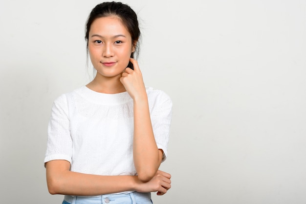 Portrait of young beautiful Asian teenage girl