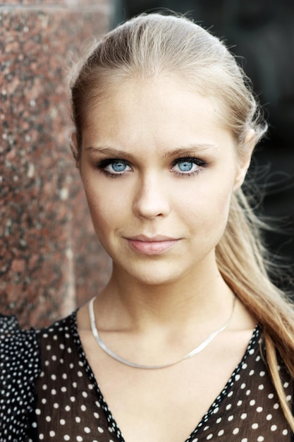 Photo portrait of a young beautiful blonde girl