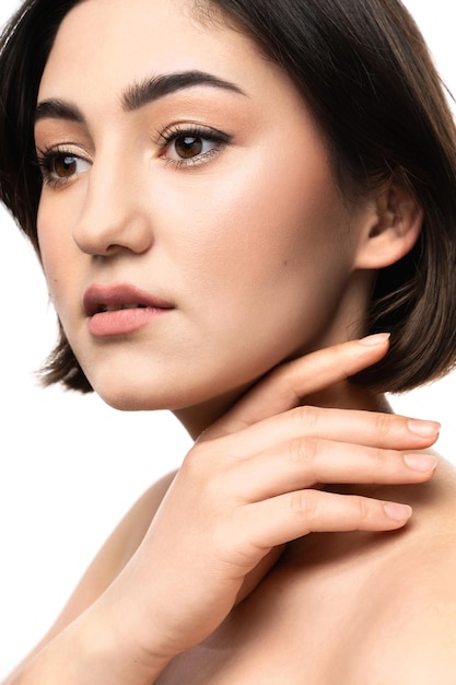 Portrait of young beautiful brunette woman on white background