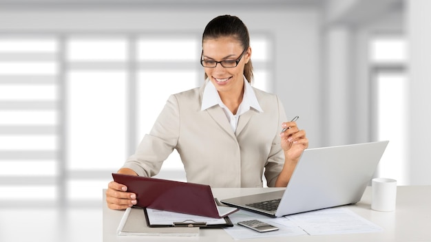 Portrait of young beautiful business woman in suit wotk in office