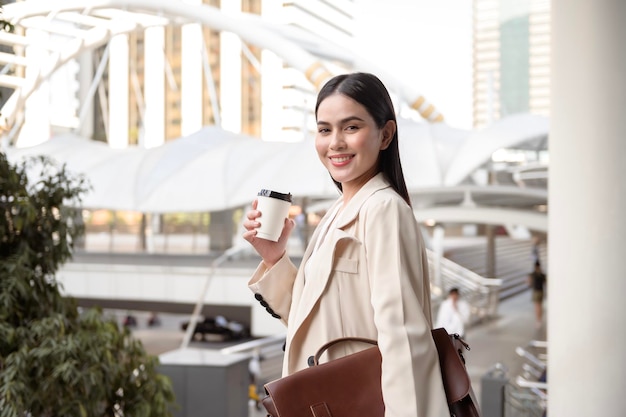 Portrait of young beautiful businesswoman in modern city